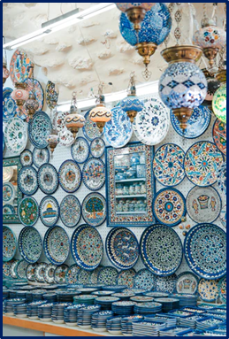display of blue pottery products at a craft store.